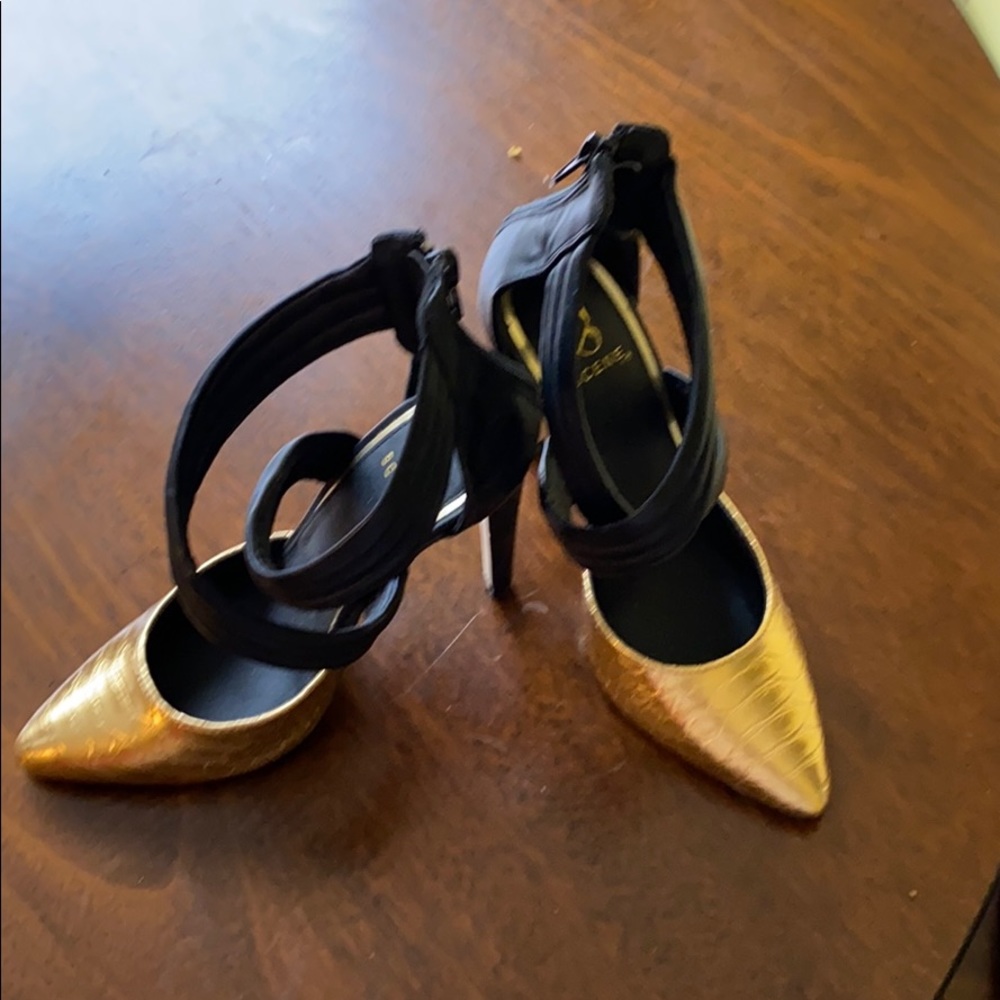 Black and gold high heels